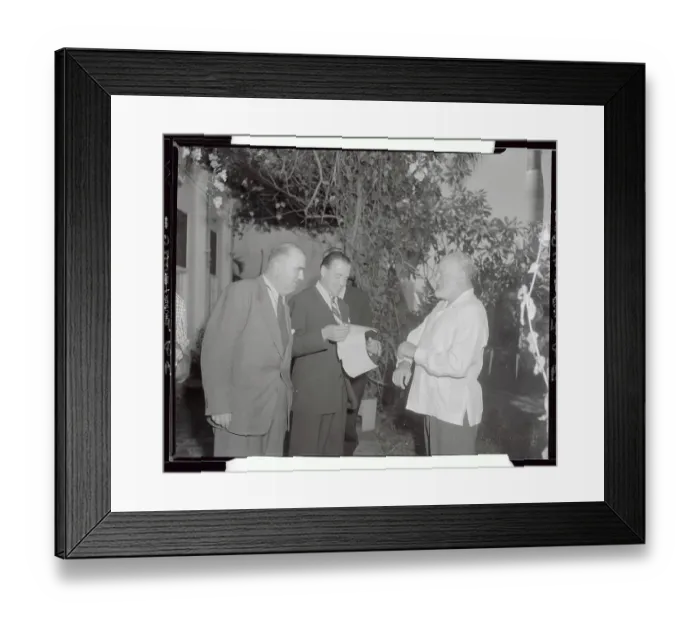 Framed Print : Ernest Hemingway Smiling with Press Framed Print : Ernest Hemingway Smiling with Press