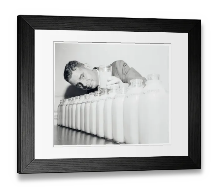 Framed Print : Conrado Asenjo Standing Behind Bottles of Juice