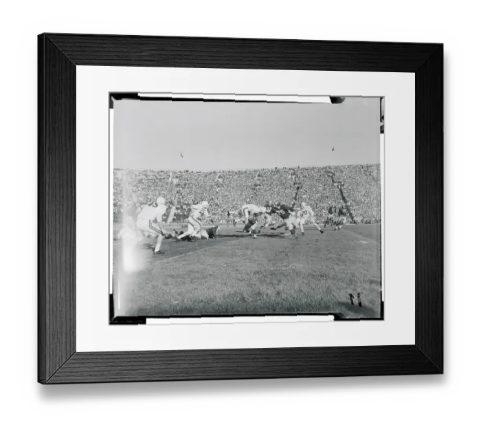 Framed Print : Football Players Competing in a Game Framed Print : Football Players Competing in a Game
