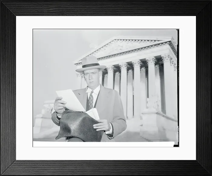 Framed Print : Lar. J. Daly Reading in Front of Building Framed Print : Lar. J. Daly Reading in Front of Building
