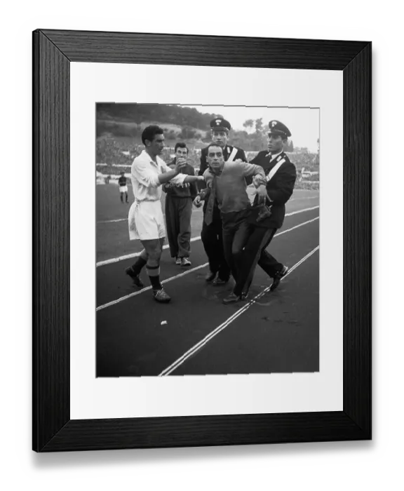 Framed Print : Police Escorting a Man Off of a Soccer Field Framed Print : Police Escorting a Man Off of a Soccer Field