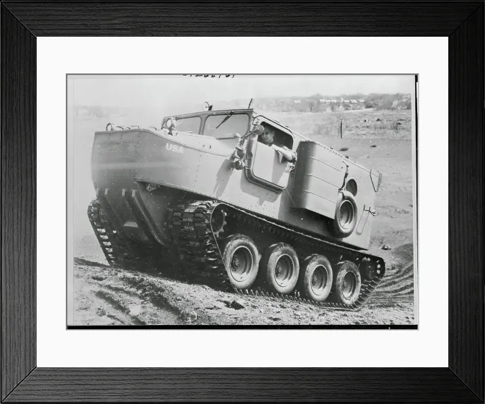 Framed Print : Man Driving a Cargo Carrier Up a Hill