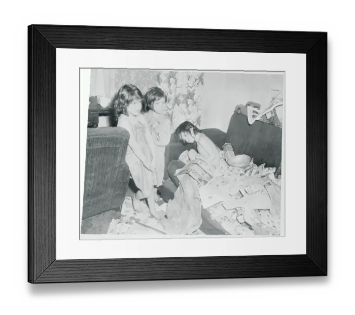 Framed Print : Children Standing by a Junk Strewn Couch