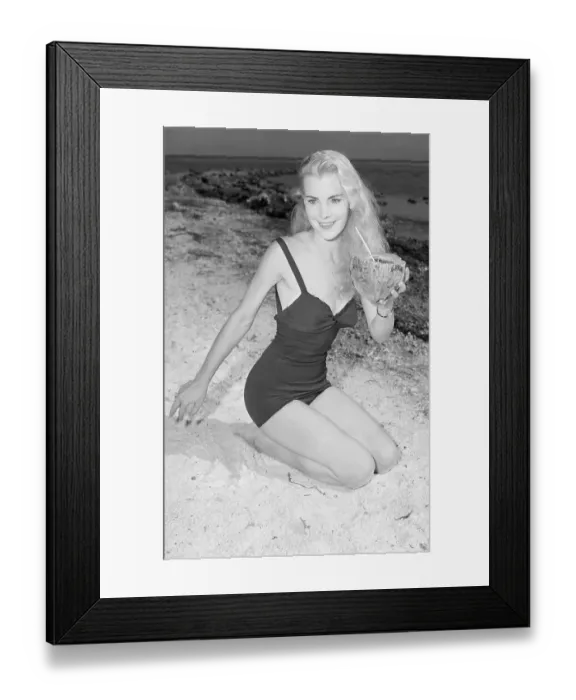 Framed Print : Model Holding Coconut on Beach Framed Print : Model Holding Coconut on Beach