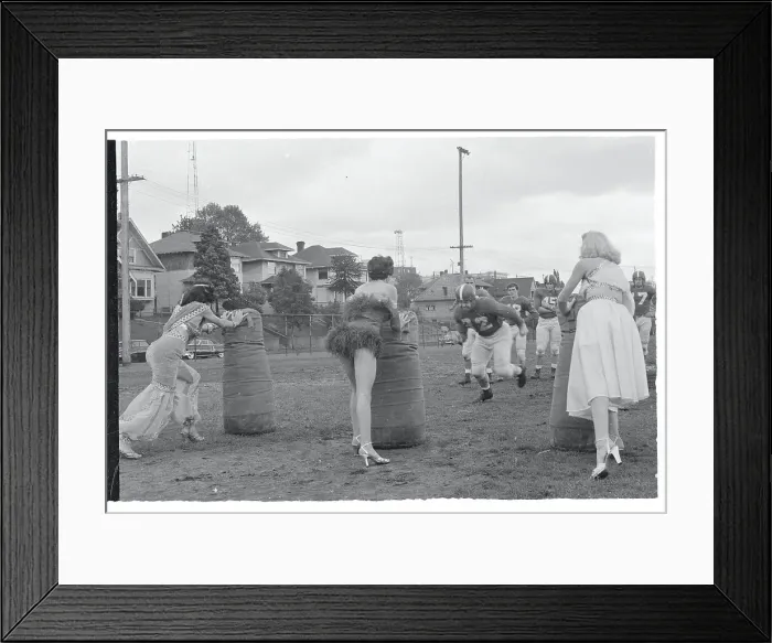 Framed Print : Women Helping a Football Team With Tackling Practice Framed Print : Women Helping a Football Team With Tackling Practice