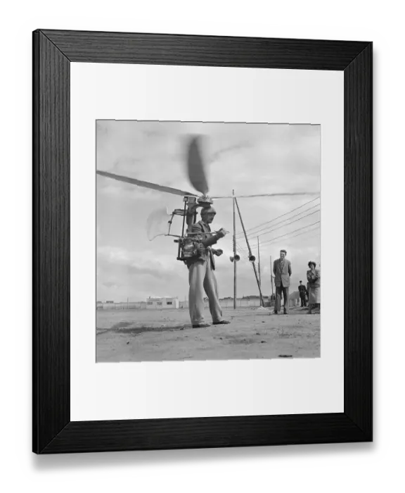 Framed Print : Inventor Demonstrating Strap-On Helicopter Framed Print : Inventor Demonstrating Strap-On Helicopter
