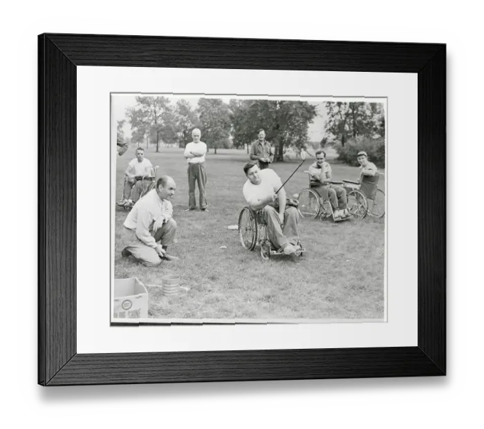Framed Print : Paraplegics Instructor Teaching Golf Skills from His Chair Framed Print : Paraplegics Instructor Teaching Golf Skills from His Chair