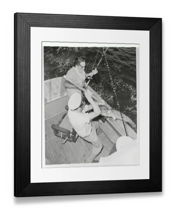 Framed Print : Mrs. Stafford Sands Pulling in a Fish Framed Print : Mrs. Stafford Sands Pulling in a Fish