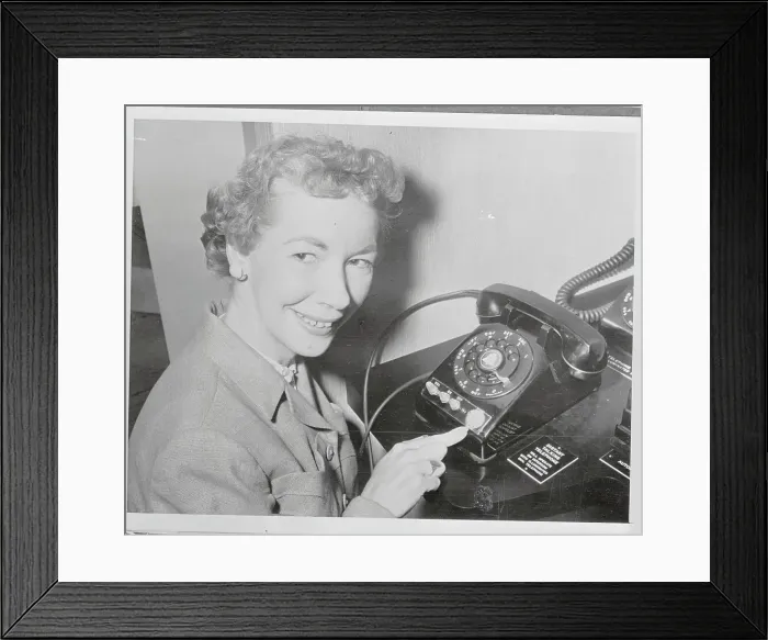 Framed Print : Rita Ackerson Demonstrating Use of a New Telephone