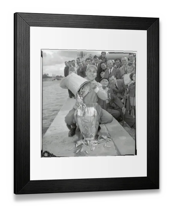Framed Print : Fernand Hubert Placing Fish into a Container