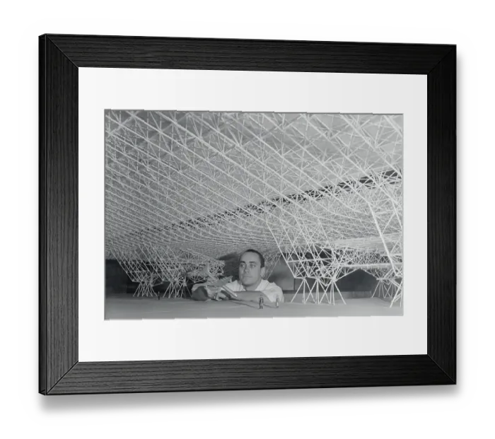 Framed Print : Douglas Rhyn Holding Model Airplane Under Model of Proposed Hanger Framed Print : Douglas Rhyn Holding Model Airplane Under Model of Proposed Hanger