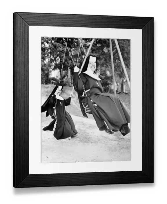 Framed Print : Nuns Swinging on Swing Set Framed Print : Nuns Swinging on Swing Set