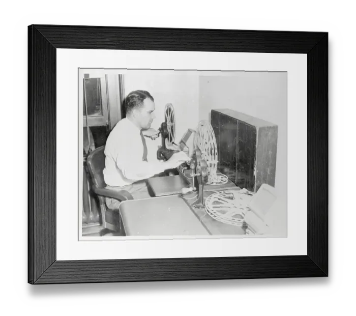 Framed Print : Hugh Daugherty Viewing Film Framed Print : Hugh Daugherty Viewing Film