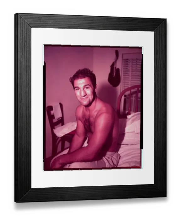 Framed Print : Rocky Marciano Sitting on Bed Framed Print : Rocky Marciano Sitting on Bed