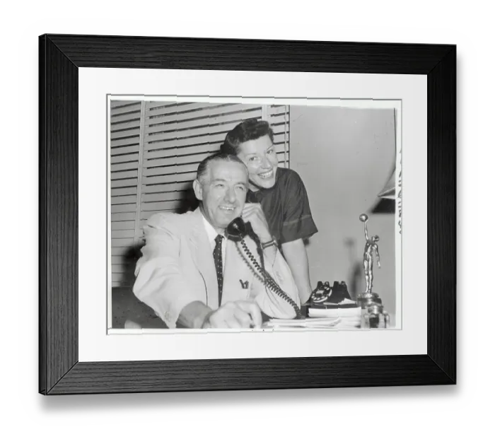 Framed Print : Nat Holman Talking on Phone with Wife and Basketball Trophy Nearby