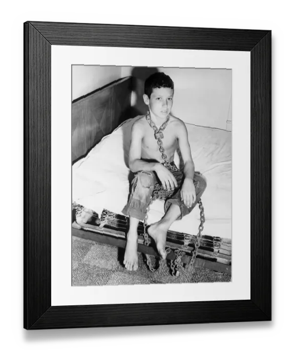Framed Print : Boy Chained by Neck to His Bed Framed Print : Boy Chained by Neck to His Bed
