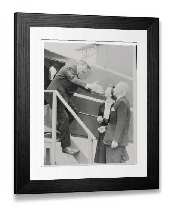 Framed Print : Joan Bennett and Husband Welcoming John Huston Framed Print : Joan Bennett and Husband Welcoming John Huston