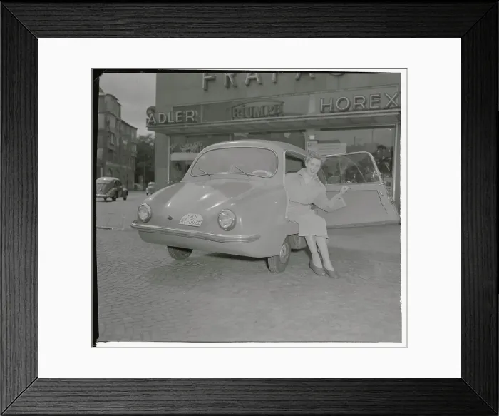 Framed Print : A Woman Getting out of New Fulda-Mobil Framed Print : A Woman Getting out of New Fulda-Mobil