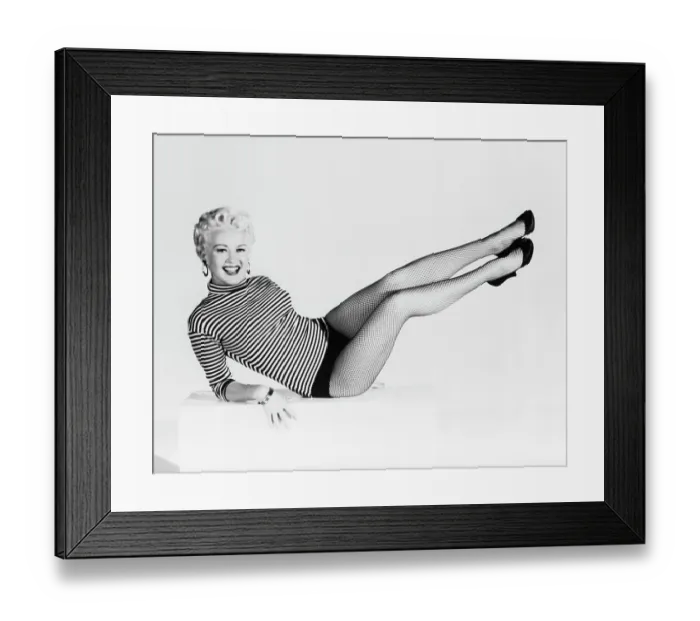 Framed Print : Betty Grable Holds Up Legs-Laying Down Framed Print : Betty Grable Holds Up Legs-Laying Down