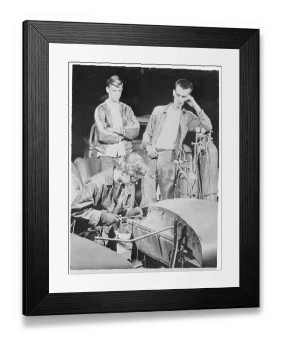 Framed Print : Woman Working on a Car Framed Print : Woman Working on a Car