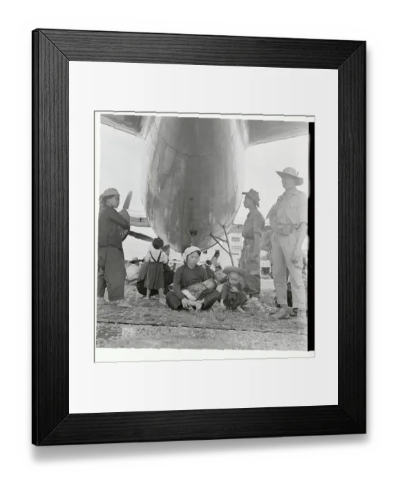 Framed Print : Mother and Children Waiting to Board a Plane Framed Print : Mother and Children Waiting to Board a Plane