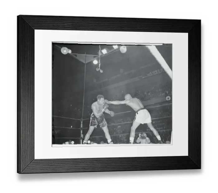 Framed Print : Harold Johnson Punching Archie Moore Framed Print : Harold Johnson Punching Archie Moore
