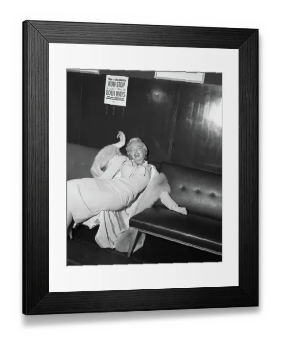 Framed Print : Marilyn Monroe Lying on Couch Framed Print : Marilyn Monroe Lying on Couch