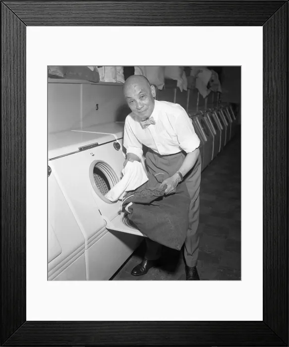 Framed Print : Ying H. Wen Taking Clothing Out of Dryer Framed Print : Ying H. Wen Taking Clothing Out of Dryer