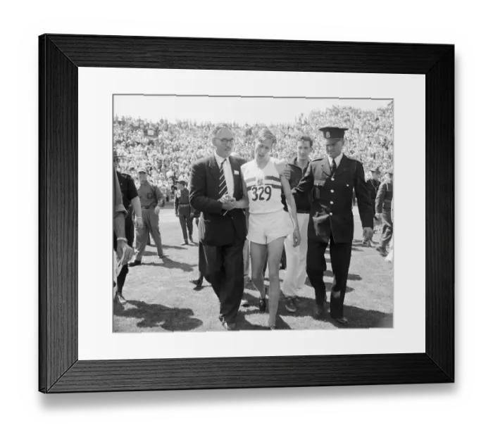 Framed Print : Roger Bannister Being Helped Off Racetrack Framed Print : Roger Bannister Being Helped Off Racetrack
