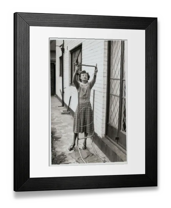 Framed Print : Woman Assembling a Ladder Framed Print : Woman Assembling a Ladder