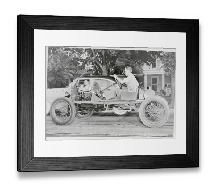 Framed Print : Man Riding in Open Framed Car Framed Print : Man Riding in Open Framed Car