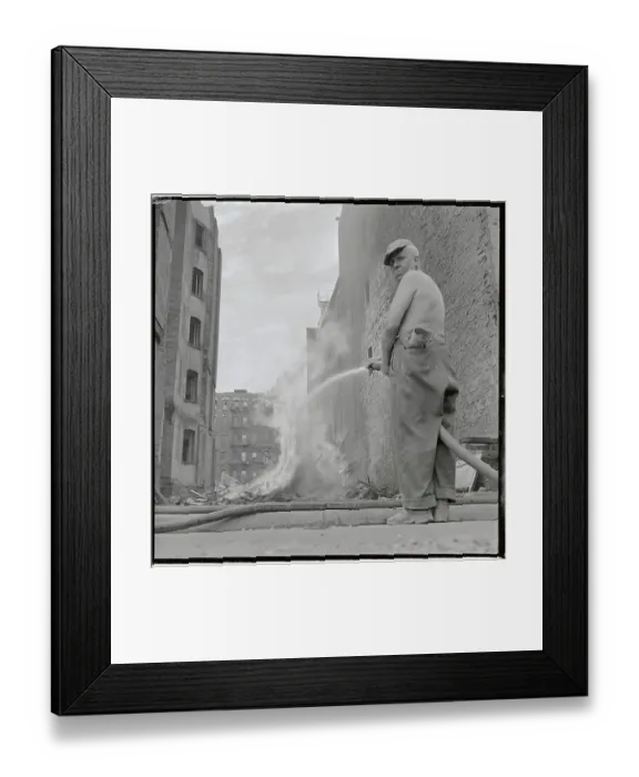 Framed Print : Man Using Hose to Contain Fire Framed Print : Man Using Hose to Contain Fire