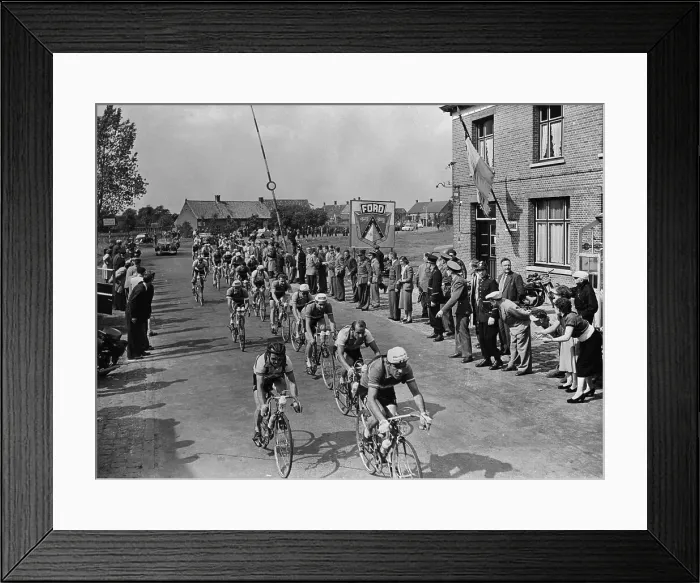 Framed Print : Tour de France Riders Riding Down Street Framed Print : Tour de France Riders Riding Down Street