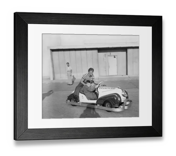 Framed Print : Kirk Douglas and Sons Driving Tiny Car Framed Print : Kirk Douglas and Sons Driving Tiny Car