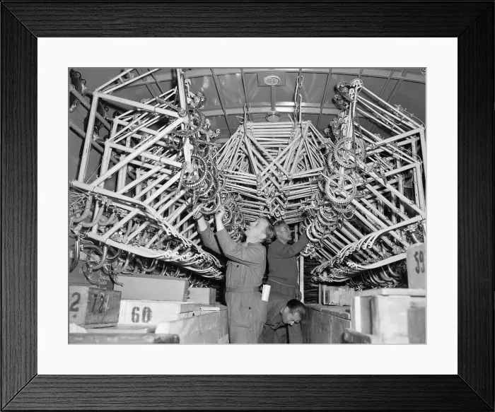 Framed Print : Man Looking over Bicycle Parts Framed Print : Man Looking over Bicycle Parts