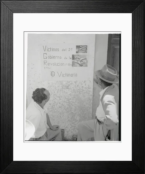 Framed Print : Two Men Looking at Poster on Wall Framed Print : Two Men Looking at Poster on Wall