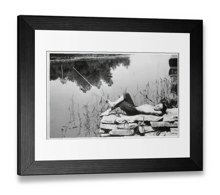 Framed Print : Boy Laying on Rocks While Fishing Framed Print : Boy Laying on Rocks While Fishing