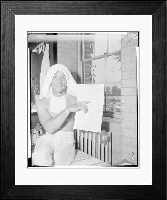 Framed Print : Eddie Arcaro Holding Race List Framed Print : Eddie Arcaro Holding Race List