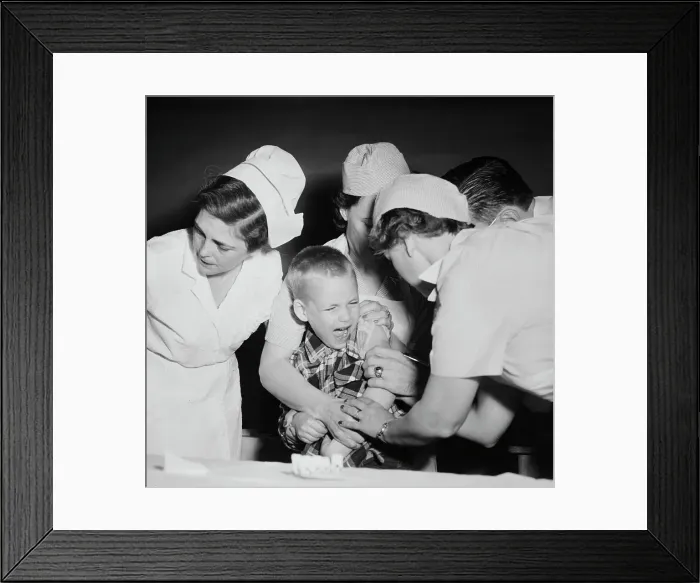 Framed Print : Nursing Staff Members and Doctor Innoculating Young Boy Framed Print : Nursing Staff Members and Doctor Innoculating Young Boy