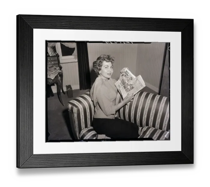Framed Print : Simone Silva with Newspaper Photographs of Robert Mitchum Framed Print : Simone Silva with Newspaper Photographs of Robert Mitchum