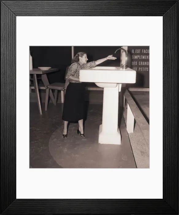 Framed Print : Woman Reaches For Oversized Faucet Framed Print : Woman Reaches For Oversized Faucet