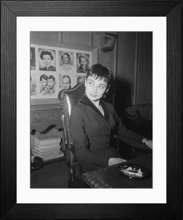 Framed Print : Audrey Hepburn Sitting at desk Framed Print : Audrey Hepburn Sitting at desk