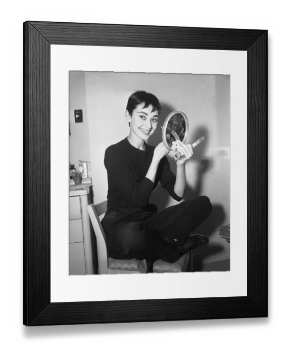 Framed Print : Audrey Hepburn Applying Makeup with Hand Mirror