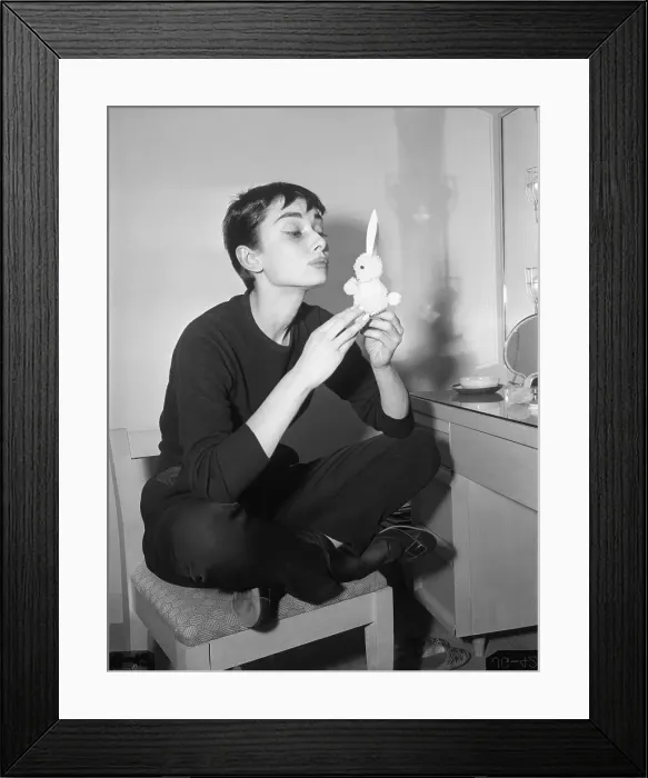 Framed Print : Audrey Hepburn Holding Small Rabbit Charm Framed Print : Audrey Hepburn Holding Small Rabbit Charm