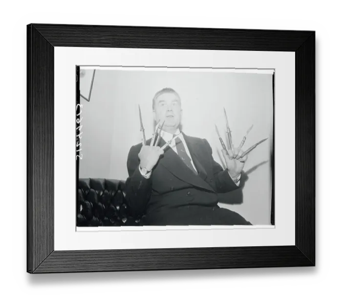 Framed Print : James Delaney Holding Switchblade Knives