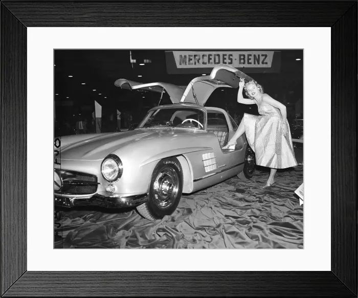 Framed Print : Model Standing By German Sports Car Framed Print : Model Standing By German Sports Car