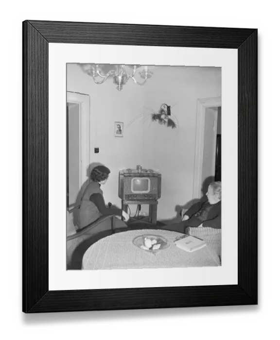 Framed Print : Seated Women Watch Tv In Room W / Table Framed Print : Seated Women Watch Tv In Room W / Table