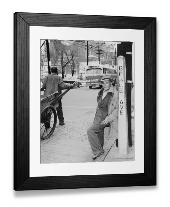 Framed Print : Man Leaning Against Street Sign Framed Print : Man Leaning Against Street Sign