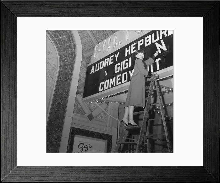 Framed Print : Audrey Hepburn Placing Letters on Marquee Framed Print : Audrey Hepburn Placing Letters on Marquee