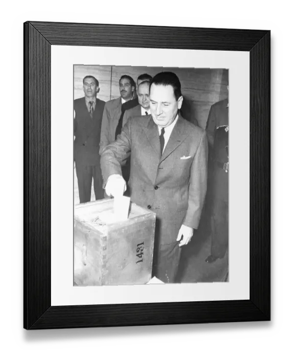 Framed Print : Juan Peron Deposits Ballot in Box Framed Print : Juan Peron Deposits Ballot in Box